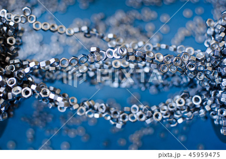 little metal nuts, magnetized to each other little metal nuts, magnetized to each other 45959475