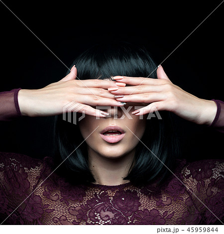 The girl covered her face with her hands 45959844