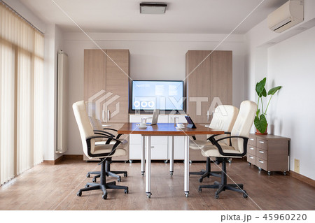 Empty conference room in business center with a TV in background 45960220
