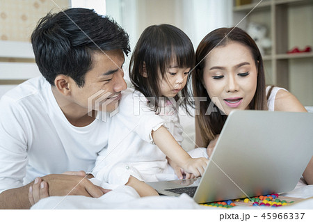 Family looking laptop at home Family looking laptop at home 45966337