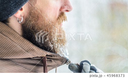 Icicles on a beard. Male portrait in profile Icicles on a beard. Male portrait in profile 45968373