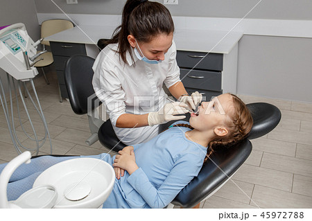 Child having dental check up in dentist office 45972788