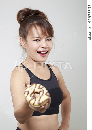 Beauty fashion Young woman holding donuts Beauty fashion Young woman holding donuts 45973353