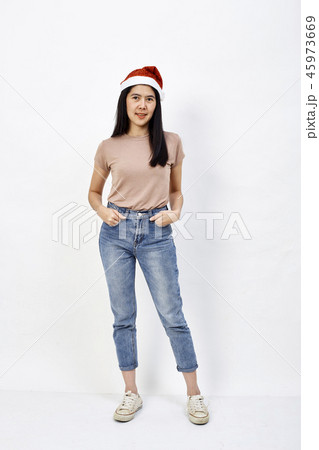 Christmas girl in santa hat on a white Christmas girl in santa hat on a white 45973669