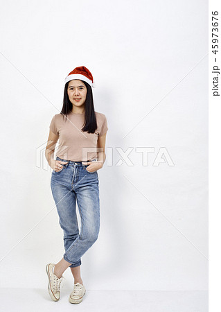 Christmas girl in santa hat on a white Christmas girl in santa hat on a white 45973676