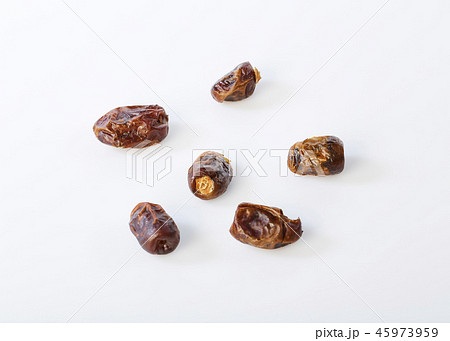 Dried halawi dates on a white Dried halawi dates on a white 45973959
