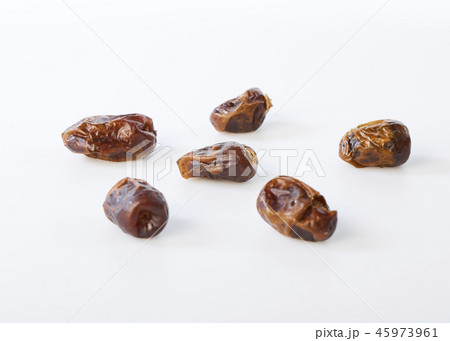 Dried halawi dates on a white Dried halawi dates on a white 45973961