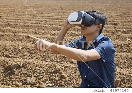 Asian man using the virtual reality headset 45974146