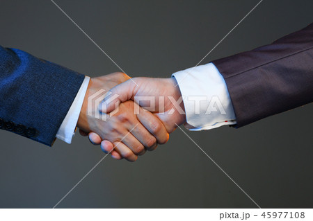 Man in suit shake hand as hello in office 45977108