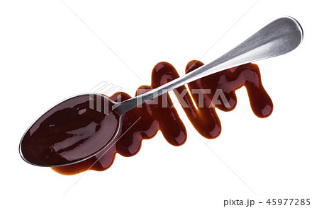 Splashes and spilled barbecue sauce with spoon isolated on white background. Top view 45977285