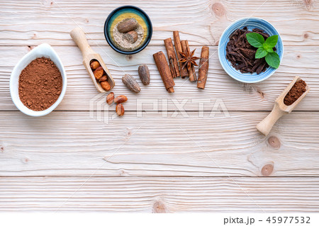 Cocoa powder and cacao beans . Cocoa powder and cacao beans . 45977532