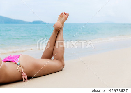 beautiful young slim woman legs sunbathe beautiful young slim woman legs sunbathe 45978627
