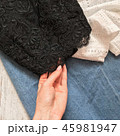 Black lace top closeup on a wooden background 45981947