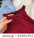 Female top claret closeup on wooden background 45981952