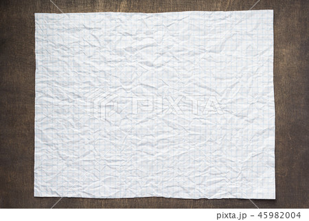 empty checked wrinkled paper at wood 45982004