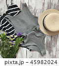 Women's gray shirt on a wooden background 45982024