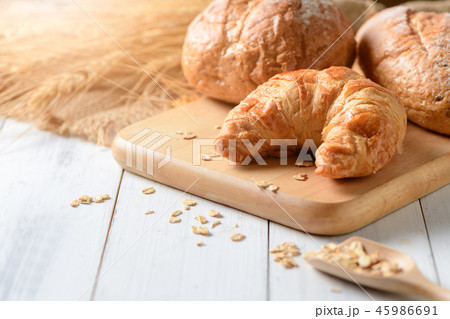 Homemade croissant and bread on old wood 45986691