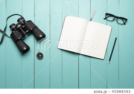 binoculars on green wooden floor binoculars on green wooden floor 45988393