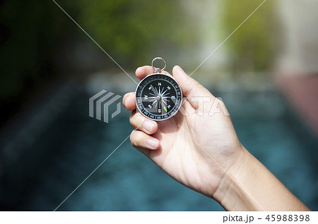 Hand holding compass Hand holding compass 45988398