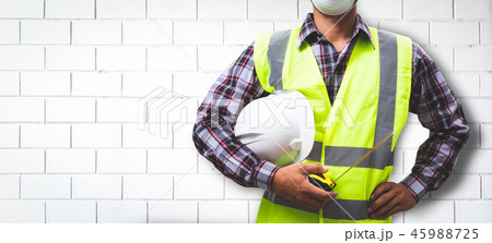 Worker is building a brick wall. 45988725