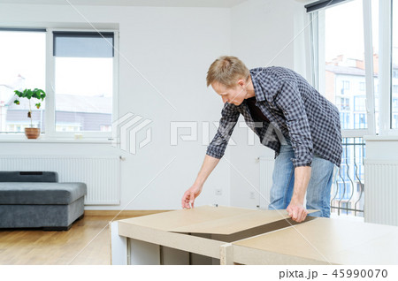 Furniture assembly at home. 45990070