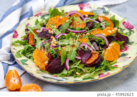 Salad of arugula, baked beets and tangerines. Salad of arugula, baked beets and tangerines. 45992623