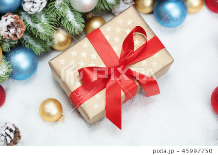 christmas gift box on snow 45997750