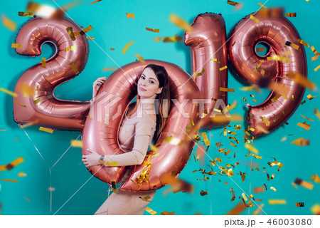 Happy new year and Merry Christmas Beautiful young woman with balloons 2019. 46003080