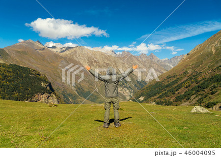 Hiker man walking mountains Hiker man walking mountains 46004095