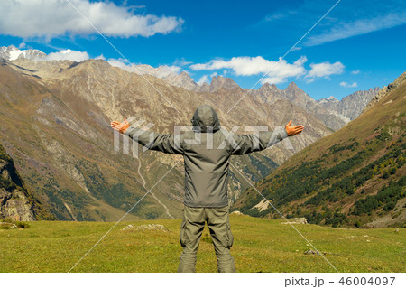 Hiker man walking mountains Hiker man walking mountains 46004097