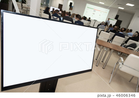 Monitor showing development plan organization against audience inconference room. Analysis Business 46006346