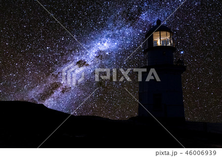 Lighthouse at night under a starry sky. Milky Way. Lighthouse at night under a starry sky. Milky Way. 46006939