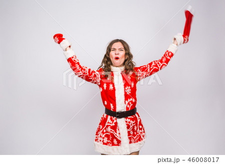 Christmas, emotions and holidays concept - excited shouting woman in santa costume on white Christmas, emotions and holidays concept - excited shouting woman in santa costume on white 46008017