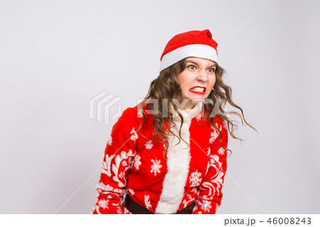 Christmas, emotions and people concept - angry woman in santa claus clothes on white background Christmas, emotions and people concept - angry woman in santa claus clothes on white background 46008243