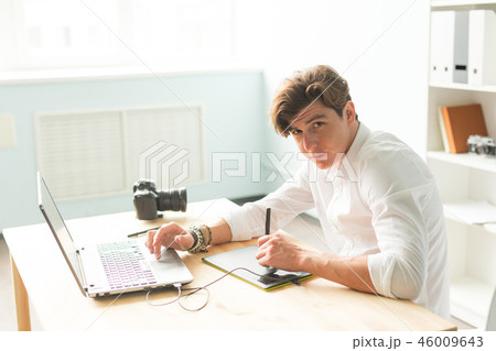 People, working and graphic tablet - young graphic designer in home office working on laptop People, working and graphic tablet - young graphic designer in home office working on laptop 46009643