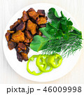 Fried meat on white plate, roast meat with green  46009998