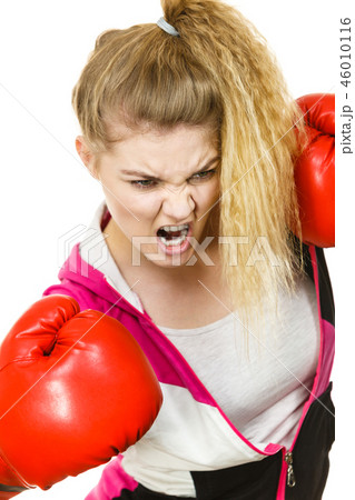 Angry woman wearing boxing gloves 46010116