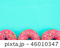 Bright tasty pink glazed donuts doughnuts on blue  46010347