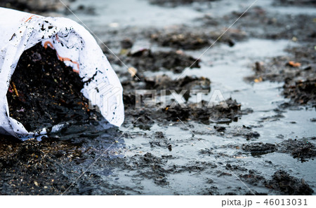 Garbage on the beach in white bag. Beach pollution 46013031