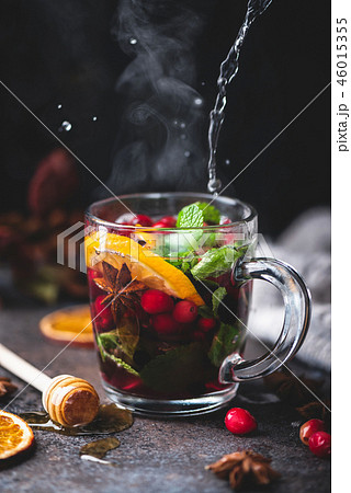 Hot fruit tea with spices, orange peel and mint 46015355