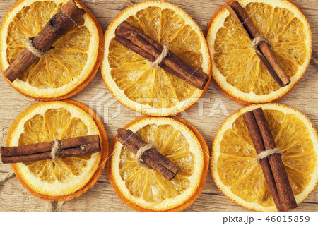 background of dried orange and cinnamon sticks background of dried orange and cinnamon sticks 46015859