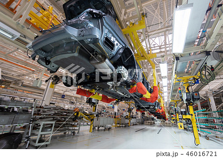 transfer of car body bottom view. Robotic equipment makes the Assembly of car. Modern car Assembly 46016721