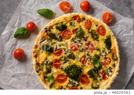 Homemade tart with broccoli, tomatoes and cheese. 46020561