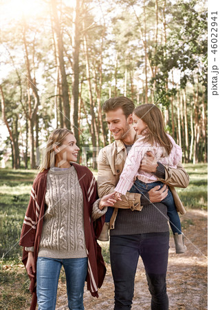 Young parents with little daughter in autumn forest. 46022941