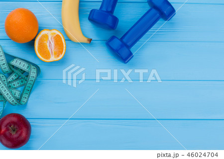 Fitness equipment, fruits and copy space. Fitness equipment, fruits and copy space. 46024704