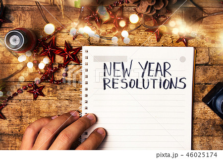 Person writing new year resolutions Person writing new year resolutions 46025174