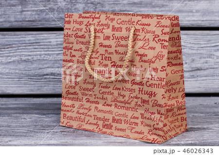 Shopping bag on wooden background. Shopping bag on wooden background. 46026343