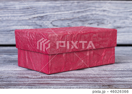 Pink gift box on wooden background. Pink gift box on wooden background. 46026366