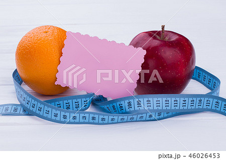 Fruits, measuring tape and blank paper card. Fruits, measuring tape and blank paper card. 46026453