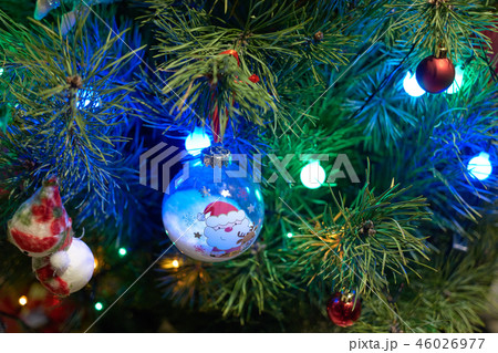 Close up of Christmas decorations hanging on tree. 46026977